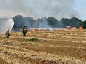 The Petrolia and North Enniskillen fire department battled a large fire in a wheat field on Churchill Line east of Wyoming Saturday. (Facebook)
