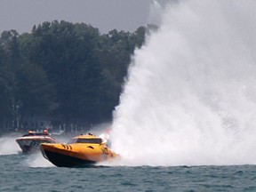 One of the powerboats racing in the St. Clair River Classic in 2019 launches a wall of water in its wake as it approaches Courtright Waterfront Park.