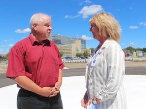 Gary Martin, president of the Lambton Federation of Agriculture, speaks with Laurie Zimmer, vice-president of clinical services at Bluewater Health, at the air ambulance helipad under construction at the hospital site in Sarnia. The federation, along with the Ontario Federation of Agriculture, contributed $5,000 to the project.