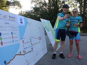 Corbin Lippert of Dorchester and Wilma Koopman of London take a selfie after checking the map at Sunday's Bluewater International Granfondo cycling event in Sarnia.