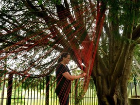 Métis artist Tracey-Mae Chambers installs her exhibit, Hope and Healing, outside Gallery Stratford.