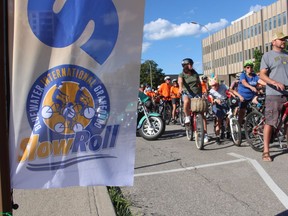 Riders wait for the start of the Sarnia BIG Slow Roll Friday evening on Front Street next to City Hall.