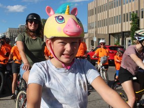 Audrey Colvin, 8, of Petrolia waits with her family for the start of the Sarnia BIG Slow Roll Friday evening.