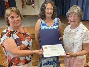Rotary Club of Norfolk Sunrise presented club member Bettyann Carty, right, with a Paul Harris Fellow award for her commitment to community service. Club member Gail Catherwood, left, and club president Louise Schebesch made the presentation at a recent meeting. CONTRIBUTED PHOTO