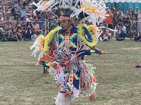 Griffin Sands, 13, of London, ON. performs in the Grand River Champion of Champions Powwow on Six Nations of the Grand River Territory on Saturday, July 23.