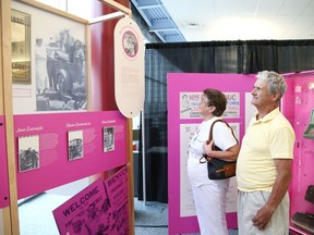 Marcel and Carmen Portelance check out the Madame Bolduc on tour exhibition at College Boreal in Sudbury, Ont. on Tuesday July 19, 2022. The Centre franco-ontarien de folklore, in collaboration with College Boreal, is presenting the exhibition. The tour features archival documents, costumes, instruments and personal letters of Mary Travers, also known as La Bolduc. John Lappa/Sudbury Star/Postmedia Network
