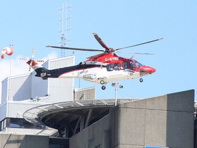 An Ornge air ambulance lands atop Health Sciences North in Sudbury, Ontario on Saturday, July 16, 2022.