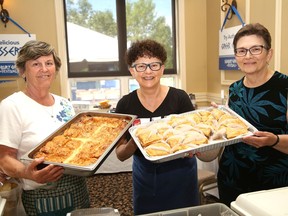 Lela Danakas, left, Matina Mattei and Matina Pontikakos display some of the desserts to be found at the Sudbury Greek Festival at the Hellenic Centre in Sudbury, Ont. on Friday July 22, 2022. The festival continues until Sunday and will be open from noon to midnight Saturday, and noon to 7 p.m. on Sunday. The festival will feature food, music and dancing, including traditional Greek dancing, as well as three additional shows on Saturday with samba dancing at 1:30 p.m., ballroom dancing at 2 p.m., and to celebrate the Ukrainian community, there will be the Ukrainian youth dancers at 3 p.m. on Saturday and 2:30 p.m. on Sunday. John Lappa/Sudbury Star/Postmedia Network