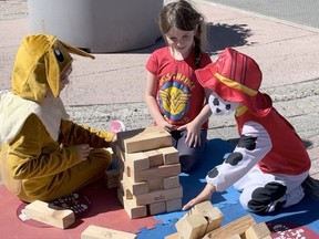 Children play with a oversized Jenga set at the first Urban Park of the season on Third Avenue and Balsam Street South. The event brings street life to downtown Timmins and is a project of the Downtown Timmins Business Improvement Association.

NICOLE STOFFMAN/The Daily Press