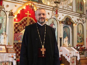 Rev. Stelian Orlando Geonea is seen here in April 2019 in front of the altar at the Sfânta Maria Church in Timmins after moving here from Bucharest, Romania. His arrival preceded several years of inactivity and uncertainty about the future of that church in Timmins. That uncertainty has been resurrected as the priest is moving to the United States where he has been assigned to another parish.  RON GRECH/THE DAILY PRESS