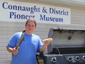 Cameron Dasti, this summer's assistant administrator at the Connaught & District Pioneer Museum, will be serving free hot dogs to visitors every Saturday from noon to 3 p.m. The museum is open weekly throughout the summer Wednesday to Sunday from 11 a.m. to 5 p.m. Admission is free.

RON GRECH/The Daily Press