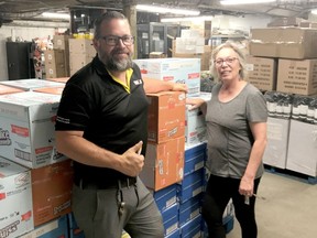 Dan Vanier, Owner/Operator of the local Giant Tiger proudly presented Cathy Beaton, Manager of the Cochrane Food Bank with 2 1/2 pallets of assorted cereal and Kraft Dinner. The dry goods will  be distributed to local residents  who rely on the Food Bank for food to feed their families. Cathy Beaton, Manager of the facility,  would also like to thank the community for donations and helping the Cochrane Food Bank. Whatever is donated in Cochrane stays in the community.