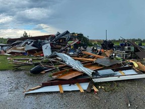 Photos show the destruction caused by a suspected tornado on Township Road 320, about 13 kilometres west of Olds.