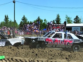 An estimated 2,500 people watched the demolition derby Saturday at Vulcan's rodeo grounds. STEPHEN TIPPER