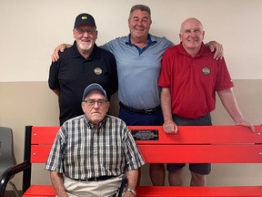 Former Durhamite and National Hockey League player Dean Hopkins is pictured with the bench he dedicated to the former Durham coaches who helped him along his way to the NHL. Seen here is Hopkins (centre) with Cecil Baines, Ron McIntyre and Glen "Punch" Marshall (seated).The bench will be at the Durham arena. Photo submitted.