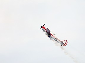 Pilot Gord Price, 80, punches through the clouds in the skies above Meaford Friday afternoon during his air show as part of the town's Canada Day celebrations. Greg Cowan/The Sun Times