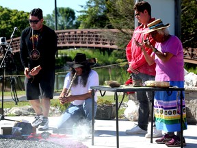 From left to right: Billy Bannick, Ken Albert, Brendan Martin and Shirley John are pictured during the pipe ceremony Sunday morning at the Giche Namewikwedong Reconciliation Garden.The burning of the sacred fire and other ceremonies at the Kelso Beach at Nawash Park garden were part of The Sound Waterfront Festival's Truth and Reconciliation day. Greg Cowan/The Sun Times