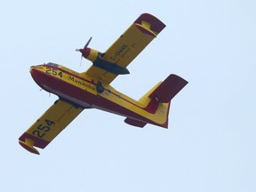 A Province of Manitoba CL-215 water bomber in flight over Winnipeg.