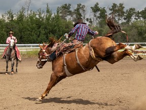 Saddle Bronc Rider riding Rich Girl from Bar JC & Co Rodeo Stock Contracting, Dyllan Duperron of Valleyview, AB.