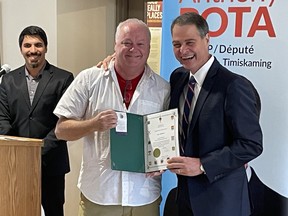 North Bay Pride founder Jason MacLennan receives his Queen's Platinum Jubilee Award from Nipissing-Timiskaming MP Anthony Rota during Wednesday's ceremony at the North Bay Museum.