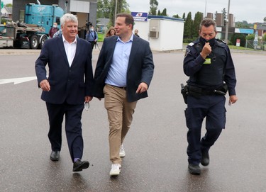 Sault Ste. Marie MP Terry Sheehan, Public Safety Minister Marco Mendicino and chief of operations Patrick Deschene at Canada Border Services Agency at International Bridge in Sault Ste. Marie, Ont., on Wednesday, Aug. 3, 2022. (BRIAN KELLY/THE SAULT STAR/POSTMEDIA NETWORK)