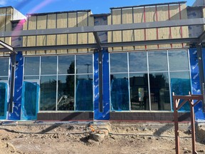 After a fire destroyed a commercial business strip and six businesses on Wye Road in April, the area is bustling with construction as a replacement is being erected.