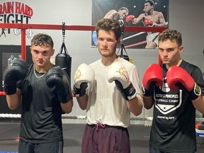 Adam Smith (left). Tyrus Fazakos (middle) and Smith's twin brother Luke, all of Bell City Boxing Club, are on the Friday Night Fights Under the Lights at Knights of Columbus hall on Friday (Aug. 5). SUBMITTED