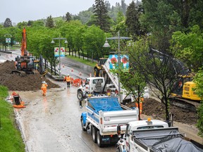In Calgary, Alberta, , a berm is being built on by the Bow River pathway bridge to protect the Sunnyside community against a potential flood on Tuesday, June 14, 2022. Azin Ghaffari/Postmedia