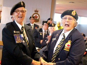 Helen Stewart, president of Royal Canadian Legion Branch 25, and her sister, Betty Irvine, dance as Royal Canadian Legion Drum and Trumpet Band play Auld Lang Syne at a closing ceremony for the branch's 55-year-old building on Wednesday, July 27, 2022 in Sault Ste. Marie, Ont. (BRIAN KELLY/THE SAULT STAR/POSTMEDIA NETWORK)