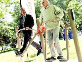 Former Chatham-Kent Mayor Randy Hope (left) and former Coun. Bryon Fluker, are seen in this 2011 file photo during the grand opening of fitness stations at the Odette Seniors Garden Park in Tilbury. Fluker died Aug. 3. File photo/Postmedia