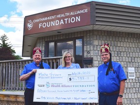 Mary Lou Crowley, president and CEO of the Chatham-Kent Health Alliance Foundation, centre, accepts a $51,738 donation from Robert Rossi, left, and Randy MacNevin, right, of the Mocha Shriners. The donation came from the estate of a Chatham-Kent resident associated with the Shriners and will be used towards new pediatric equipment for the Health Alliance. (Handout/Postmedia Network)