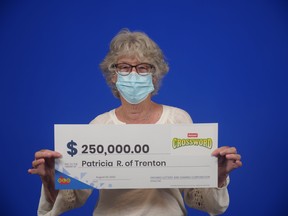 Patricia Roberts of Trenton holds up her $250,000 cheque from OLG after winning the grand prize on an Instant Crossword Deluxe lottery ticket. Submitted.