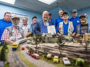 Members of the Belleville Model Railroad Club are joined alongside Bay of Quinte MPP Todd Smith on Friday morning as he presents them with a commemoration on their 50th anniversary. ALEX FILIPE