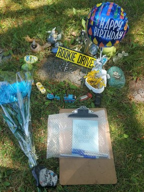 People placed items at Baby Parker's grave marker in Mount Hope Cemetery late last month — on July 28, the day he was found.  FACEBOOK