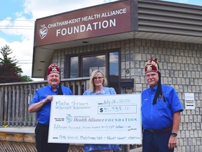 Mary Lou Crowley, president and CEO of the Chatham-Kent Health Alliance Foundation, centre, accepts a $51,738 donation from Robert Rossi, left, and Randy MacNevin, right, of the Mocha Shriners. The donation came from the estate of a Chatham-Kent resident associated with the Shriners and will be used towards new pediatric equipment for the health alliance. (Handout/Postmedia Network)