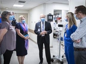 From left, Carol McIntosh, director of the emergency program at Kingston Health Sciences Centre, Health Minister Sylvia Jones, Dr. David Pichora, president and CEO of Kingston Health Sciences Centre, registered nurse Emily Murphy, clinical learning specialist in the emergency department and emergency department head Dr. David Messenger, gather in the emergency department at Kingston General Hospital on Friday. Matthew Manor/Kingston Health Sciences Centre