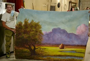 Off the Wall Artists Alliance Theater Painting student Candy McManiman shows off the scenic backdrop she painted over four days this week. Galen Simmons/The Beacon Herald/Postmedia Network