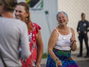 Sherri Bergman dances as the Decades Band performs in Consecon during the community's Street Dance on Saturday evening. ALEX FILIPE