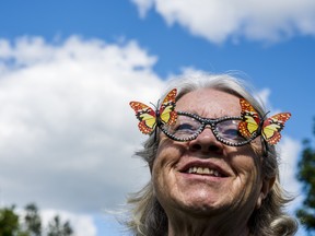 Mary Jane Goodchild, Secretary with the Marmora Lions Club, wears butterfly glasses during the Heart of Hastings Hospice butterfly release in Marmora and Lake on Saturday. ALEX FILIPE