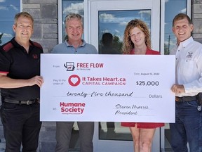 From left, Greg Sudds, chair, and Peter Malone of HSHPE’s It Takes Heart capital campaign gather with Terri and Steve Morris, owners of Flee-Flow Petroleum.