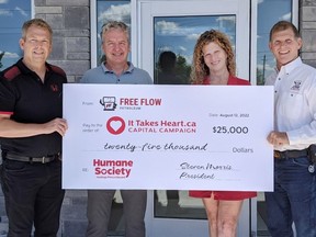 From left, Greg Sudds, chair, and Peter Malone of HSHPE’s It Takes Heart capital campaign gather with Terri and Steve Morris, owners of Flee-Flow Petroleum.