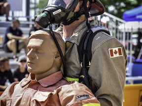 Patrick Millington, of the Quinte West Fire and Emergency Services FireFit team, drags a 175-pound ‘victim’ to safety during a recent competition.