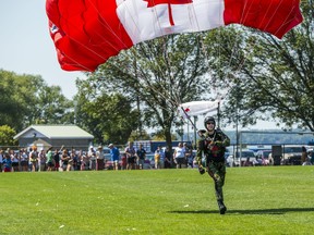 A SkyHawks demonstrator gracefully lands back on the ground after performing parachute acrobatics Saturday morning at Zwicks Centennial Park North Field in Belleville, Ontario. ALEX FILIPE.