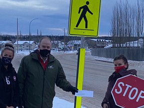 Whitecourt Mayor Tom Pickard hands out grants given to school crossing guard programs last year. Photo Supplied