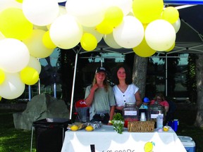 Lemonade Day booth owners, Isabella Mackenzie (left) and Jordyn Hatch (right), operated their booth at the Pincher Creek Pool, 895 Main Street.