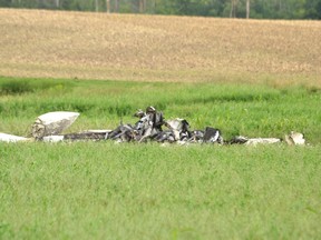 The remains of one person were removed from the wreckage of a small, double-engine plane that crash in a field north of Perth Line 43 Tuesday morning. Galen Simmons/The Beacon Herald/Postmedia Network