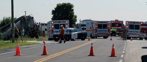 Lambton County firefighters, police and paramedics respond to a crash at the intersection of Inwood Road and Courtright Line in Brooke-Alvinston Tuesday.  (Terry Bridge/Sarnia Observer)