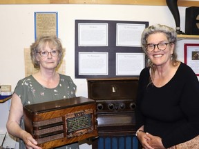 Lac Ste. Anne Historical Society Treasurer Judy Rhese, left, and Secretary Jacquie Paul showed off the new radios in Rochfort Bridge Pioneer Museum’s communications section. BRAD QUARIN/Postmedia