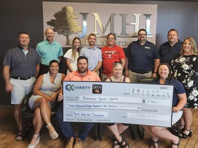 The Blenheim Youth Centre received $11,810 in proceeds from the CK Charity Classic held in early August. Shown in the back row are Eric Goudreau, Eric Koscielski, Ashley Wilton, Elliot Wilton, Jeff Comiskey, Adam Dickinson, Andrew Theil and Lori Phillips. In the front row are Catie Hawryluk, BJ Griffiths, Renee Geniole and Erin Dickinson. (Handout/Postmedia Network)