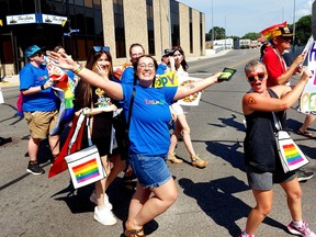 Sam Erdelyi (left) and Amanda Burk, were among the many participants in the Chatham-Kent Pride Parade held in downtown Chatham on Aug. 20. Ellwood Shreve/Postmedia